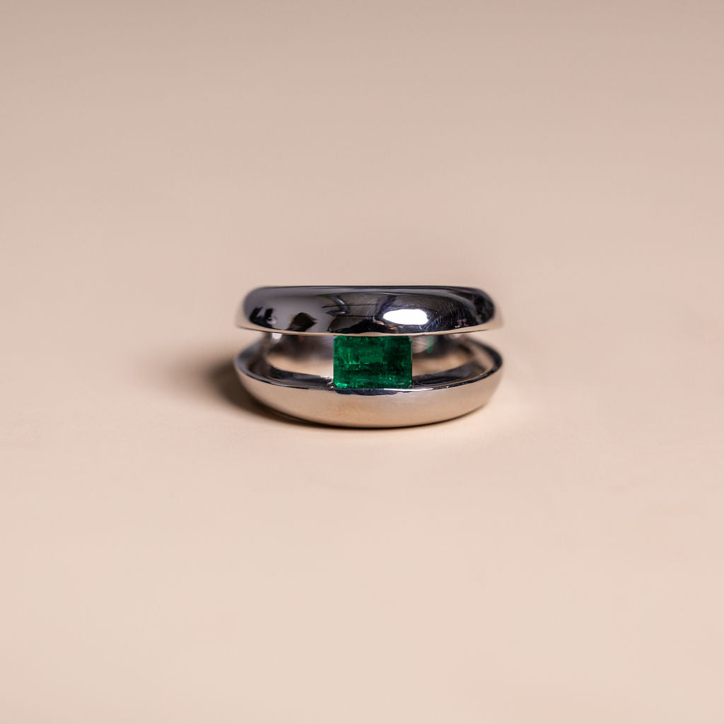 18k white gold emerald cut green emerald chunky tension set ring modern vintage