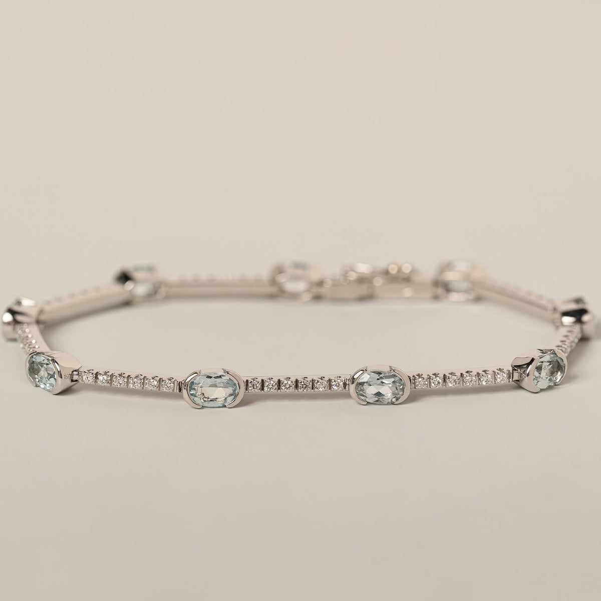 18k white gold oval aquamarine and diamond tennis bracelet