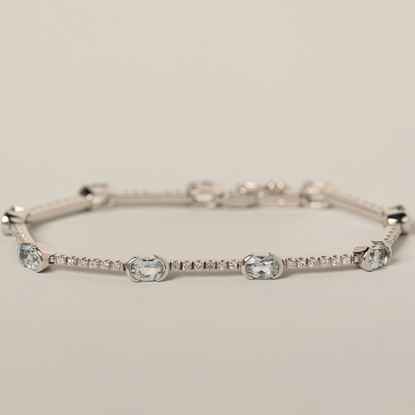 18k white gold oval aquamarine and diamond tennis bracelet