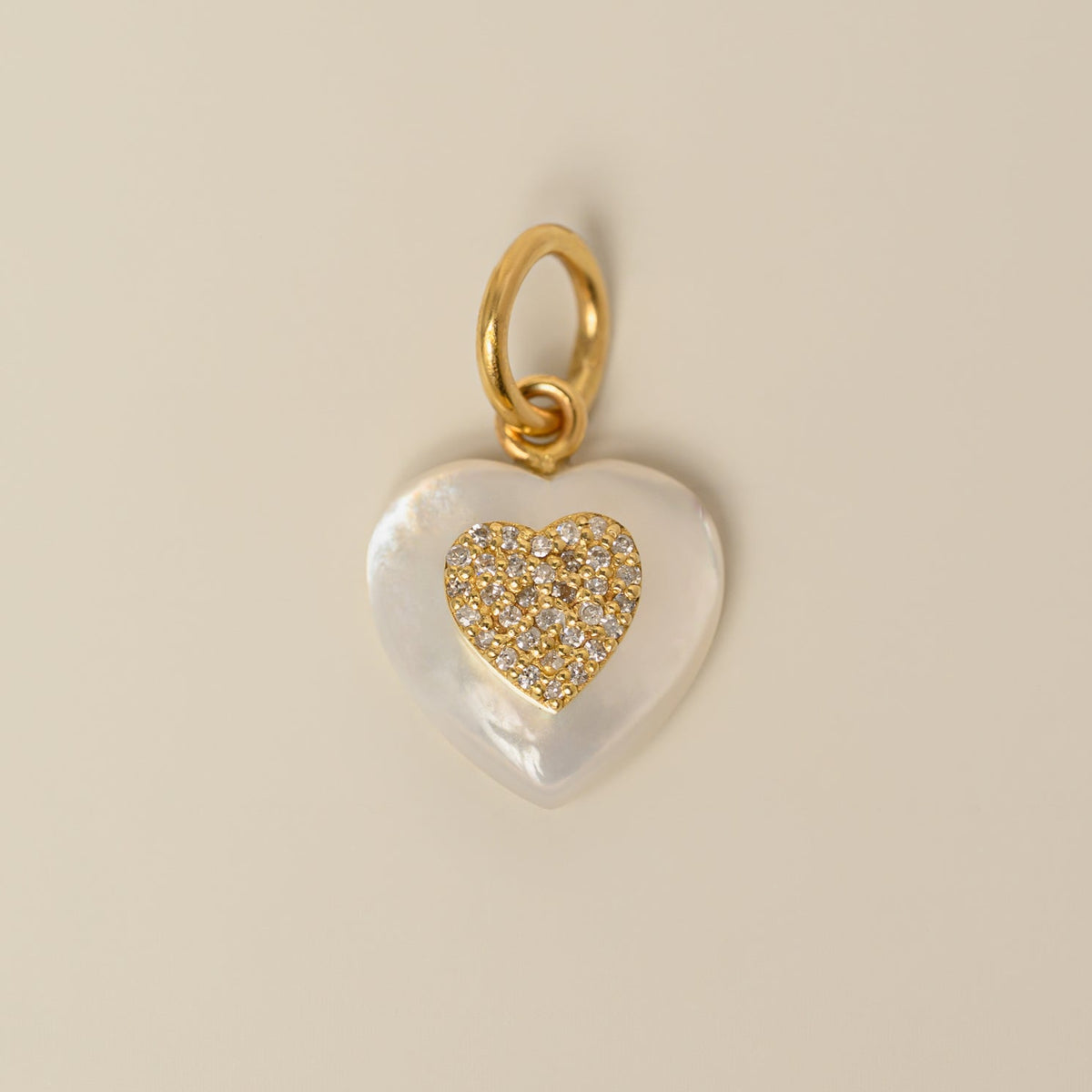 14k yellow gold diamond pave on heart shaped puffed white crystal charm pendant