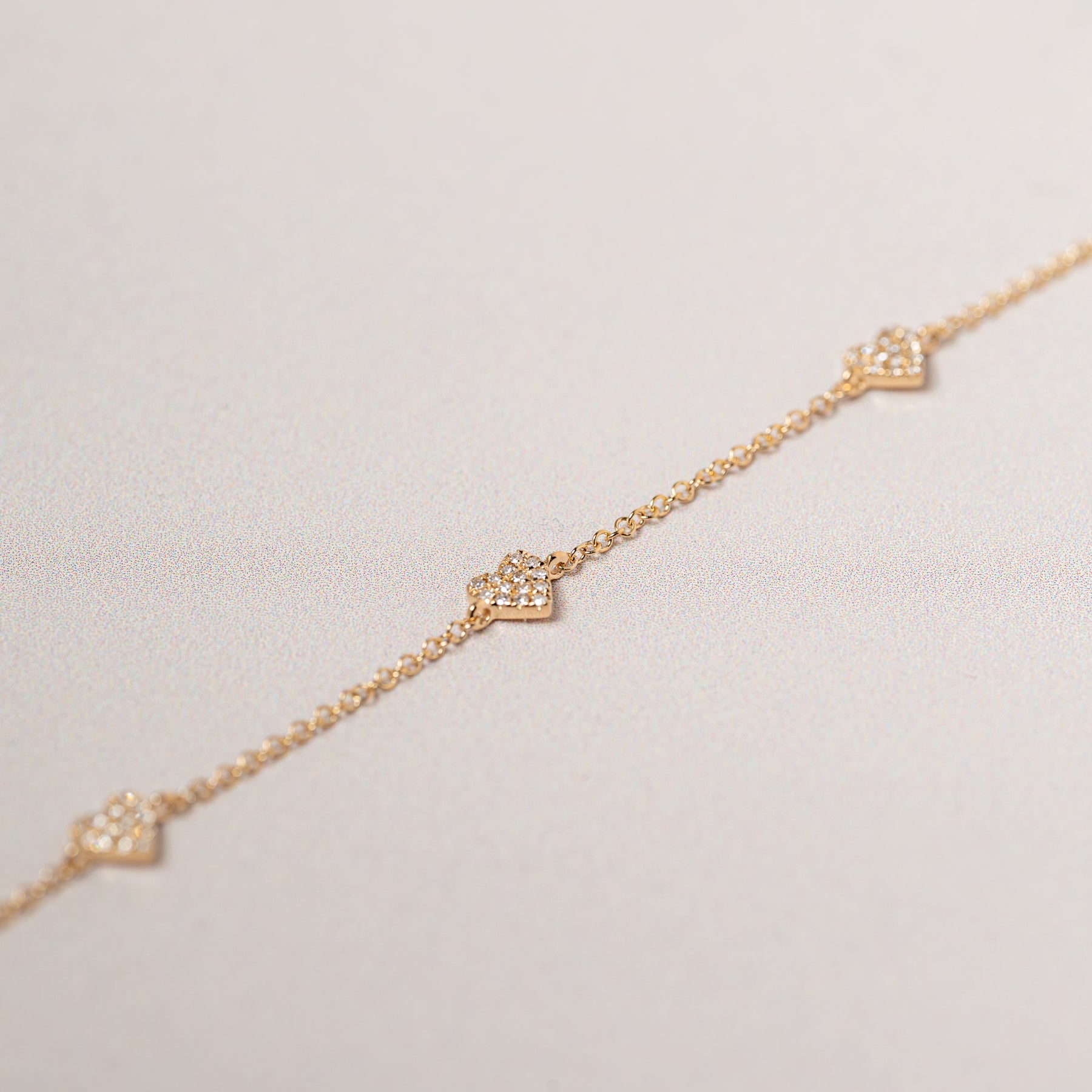 14k yellow gold diamond pave heart station bracelet