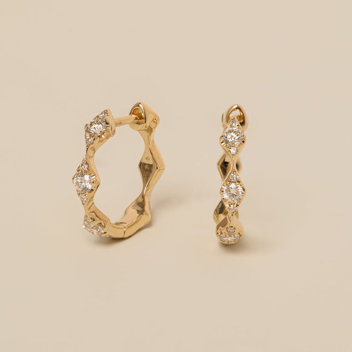 14k gold diamonds on diamond huggie hoop earrings