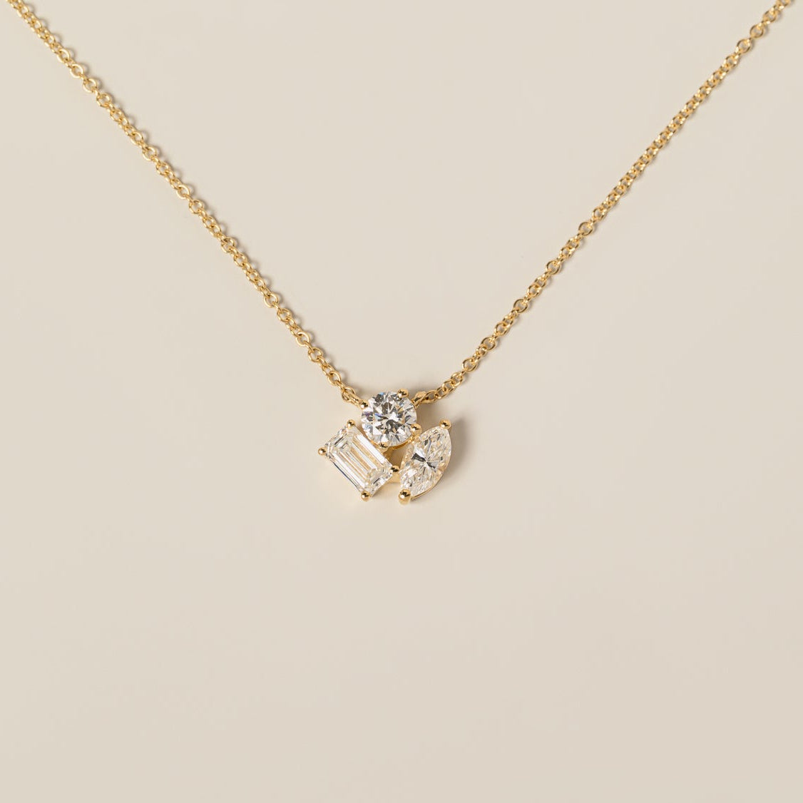 14k yellow gold round brilliant cut emerald cut marquise cut lab diamond cluster pendant necklace