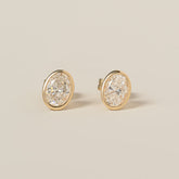 14k yellow gold bezel set oval cut lab diamond stud earrings