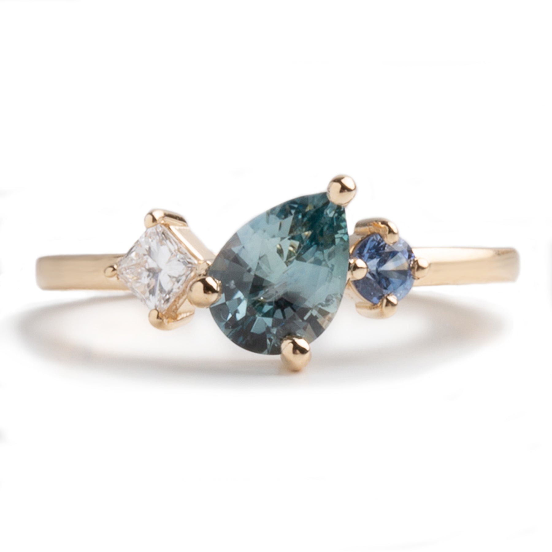 0.95ct pear shape Montana sapphire square diamond round sapphire accent stones 14k yellow gold gemstone ring