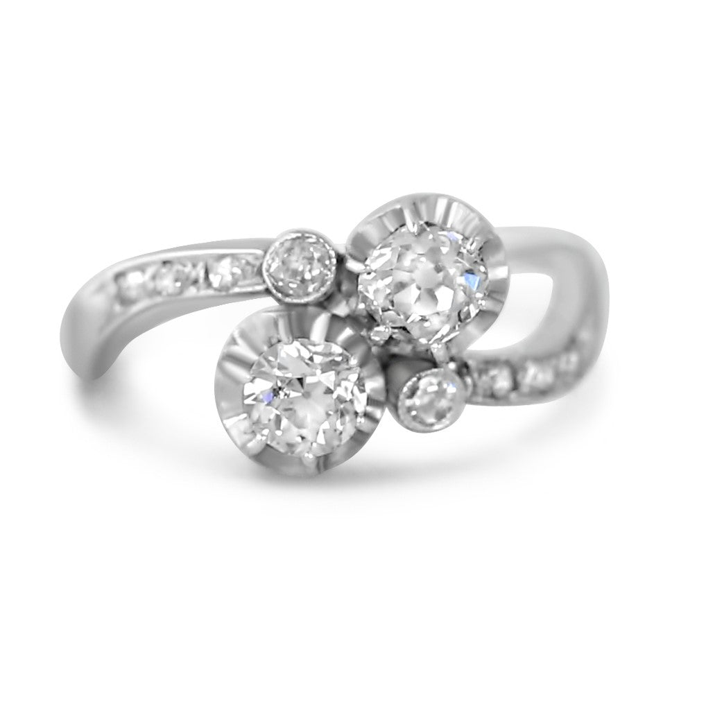 antique bypass ring in platinum with old mine cut and single cut diamonds