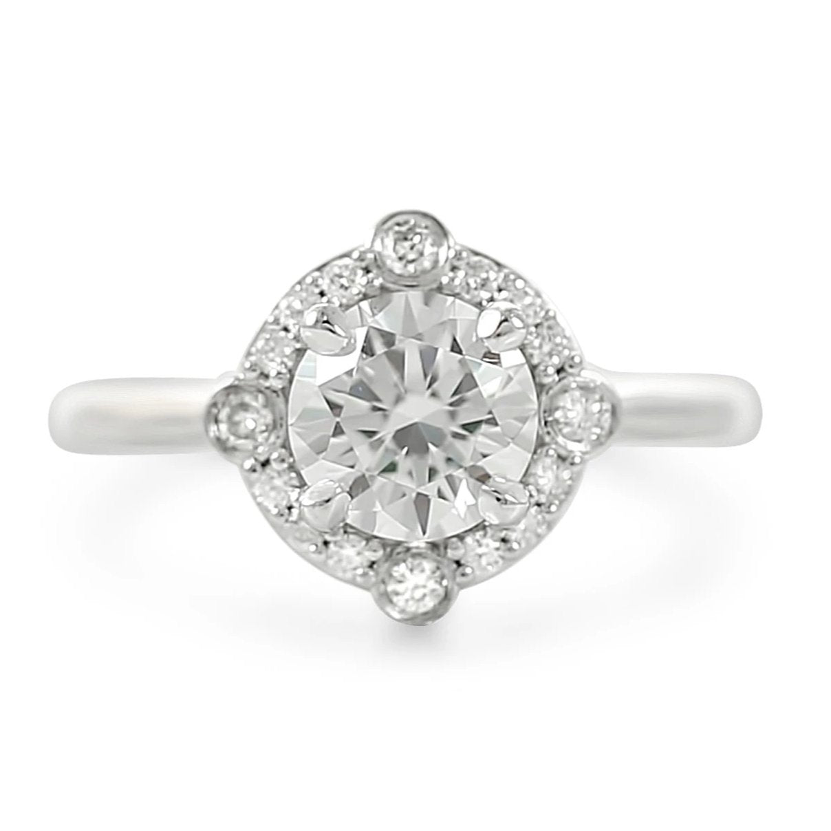 North, south, east, west diamond halo engagement ring ready to ship with a diamond center stone available in 14k yellow, white, rose or peach gold and platinum