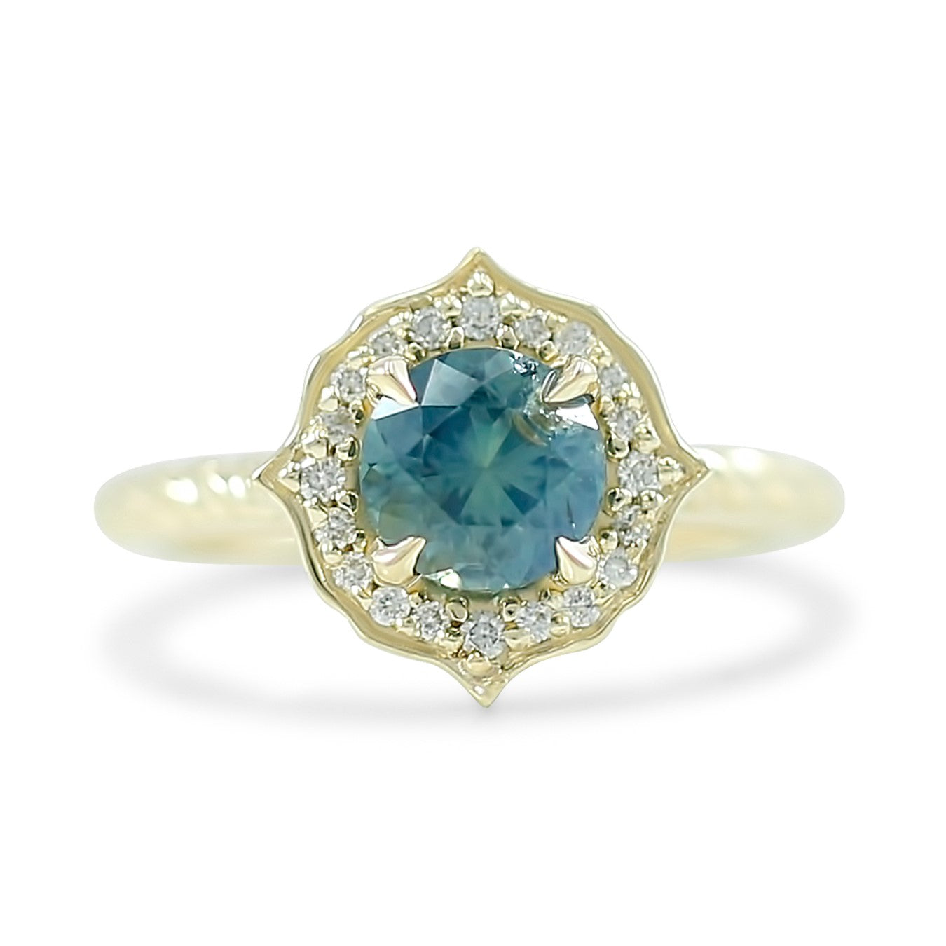 1.10ct round no heat kenya sapphire engagement ring with a custom diamond halo and a 14k yellow gold rope band