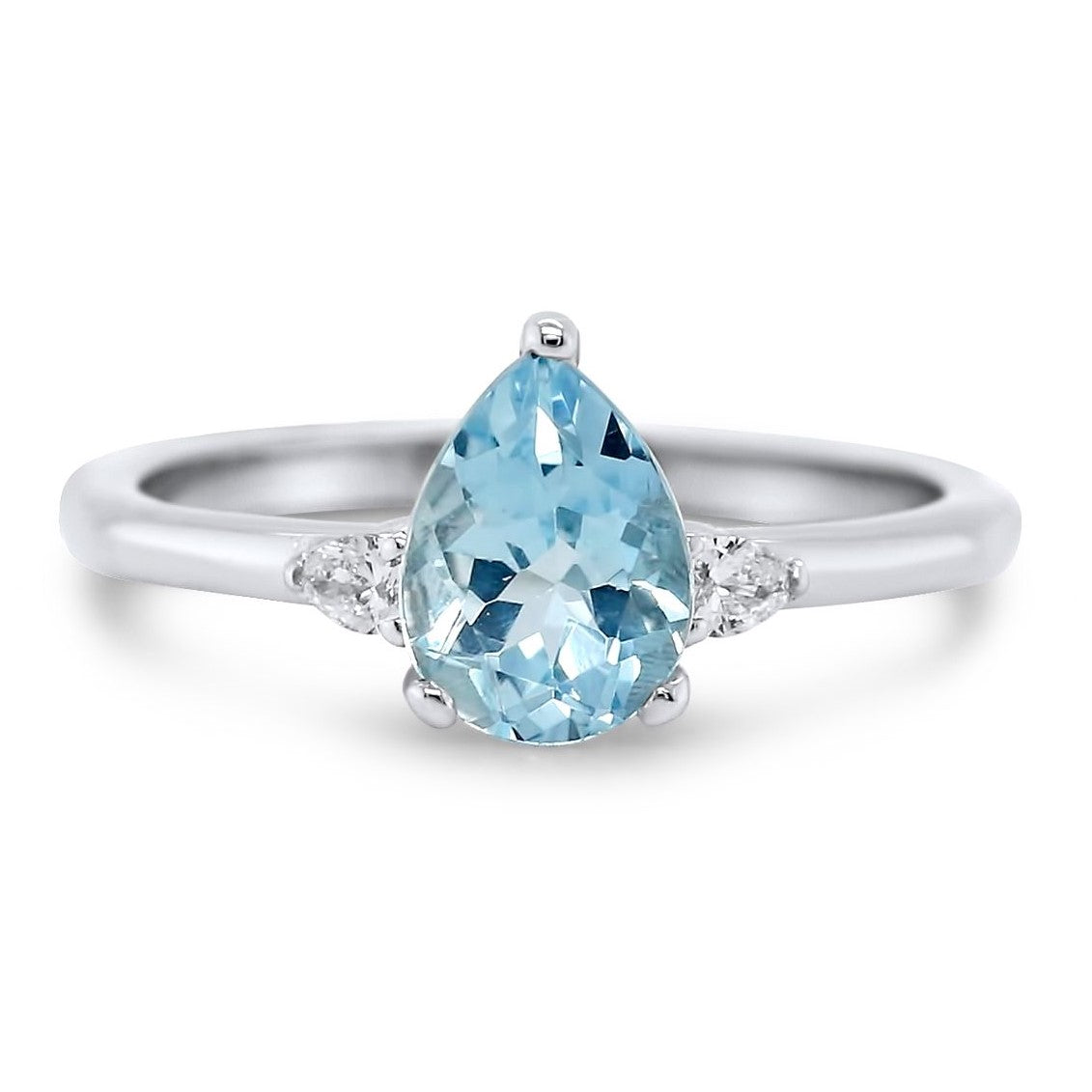 14k white gold three stone pear shaped aquamarine gemstone ring with a pear shaped diamond on each side