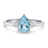 14k white gold three stone pear shaped aquamarine gemstone ring with a pear shaped diamond on each side