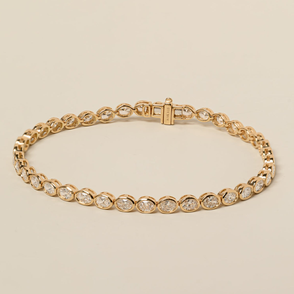 14k gold east west lab diamond oval cut bezel set tennis bracelet