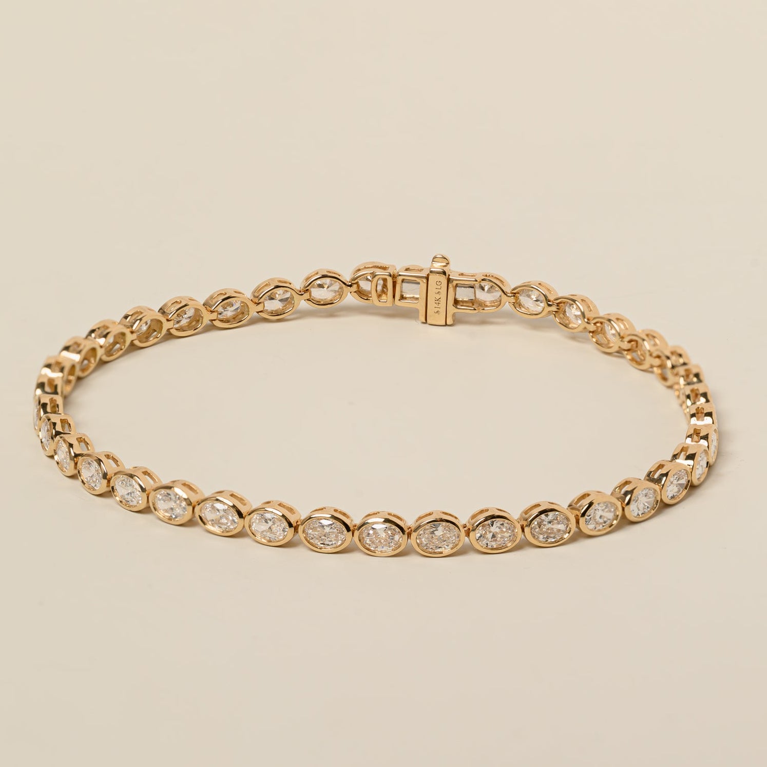 14k gold east west lab diamond oval cut bezel set tennis bracelet