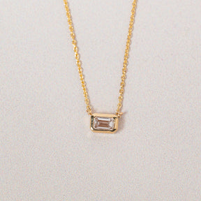 14k yellow gold bezel set emerald cut lab grown diamond east west diamond pendant necklace