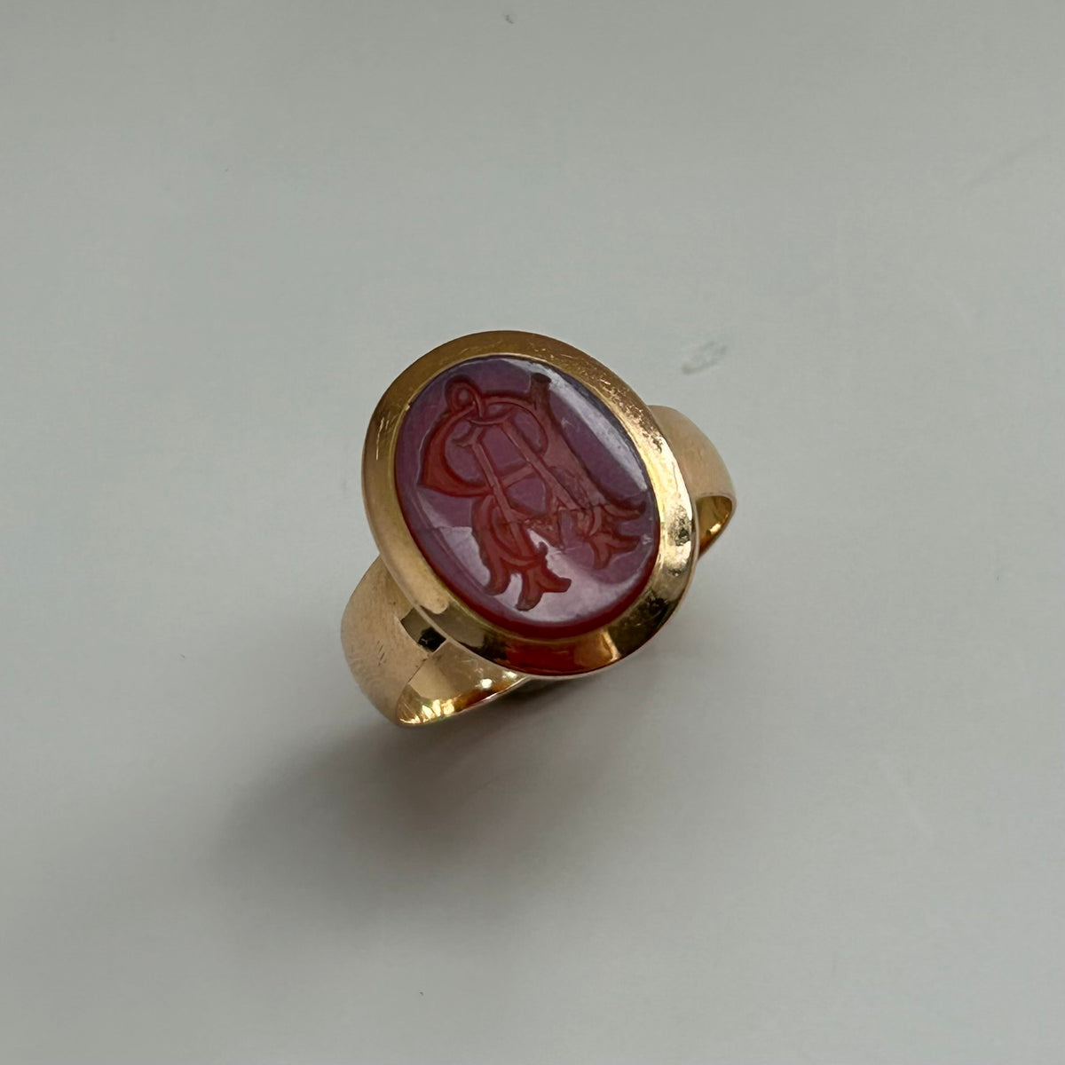 9K Oval Stamped Red Stone Signet Ring