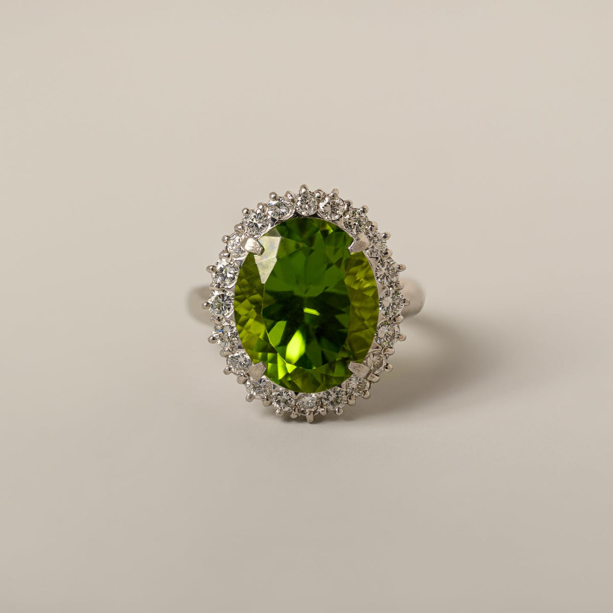 platinum oval peridot diamond halo mid 20th century cocktail ring