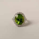 platinum oval peridot diamond halo mid 20th century cocktail ring