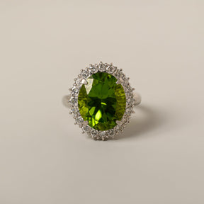 platinum oval peridot diamond halo mid 20th century cocktail ring