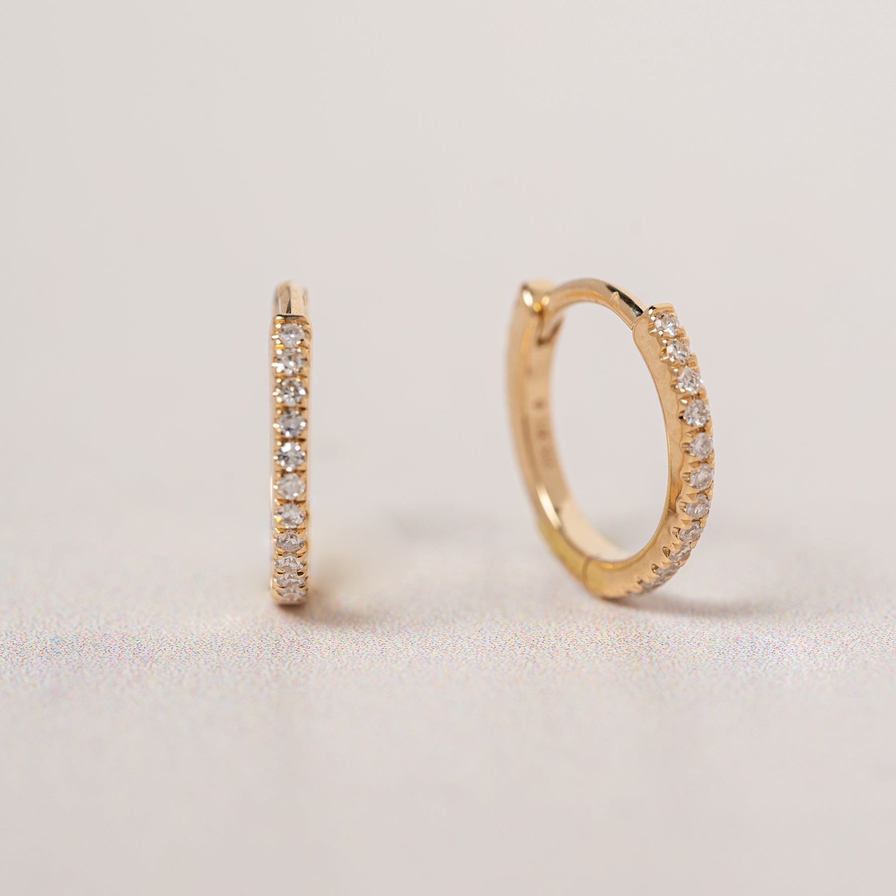 14k yellow gold diamond pave huggie hoop earrings
