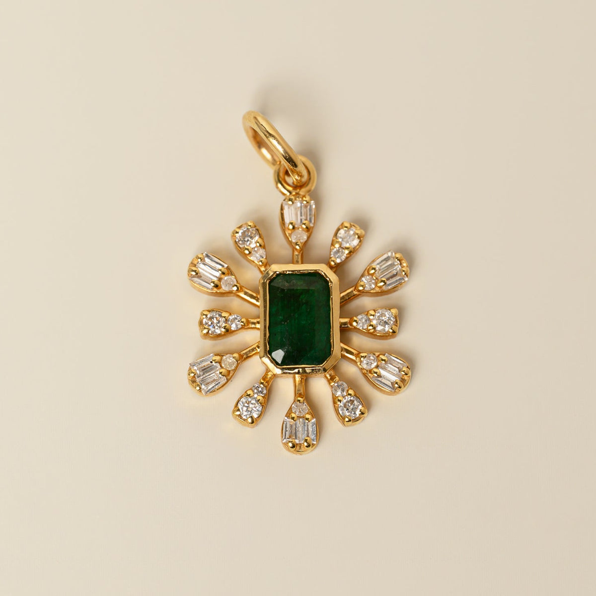 14k yellow gold bezel set green emerald accent round and baguette diamond charm pendant