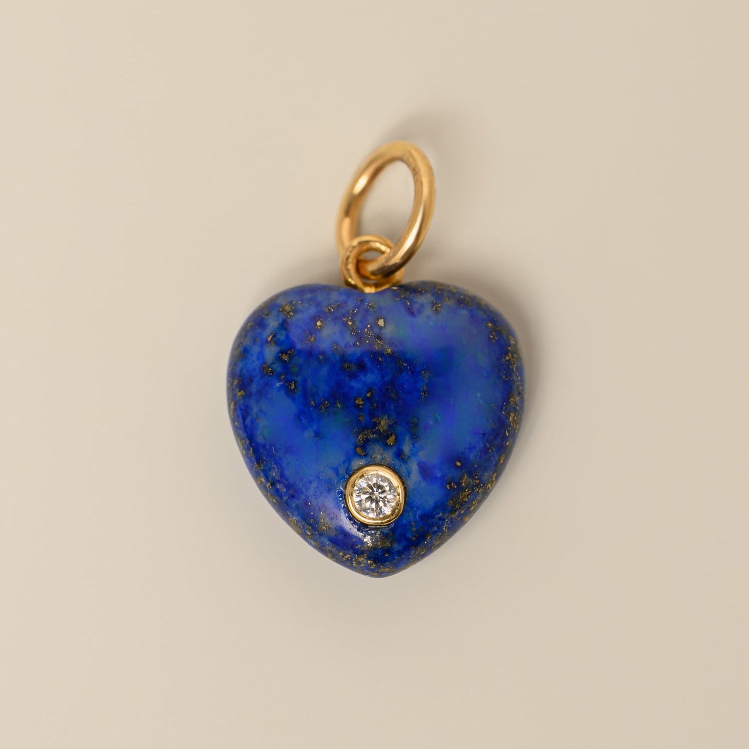 14k yellow gold puffed heart shaped lapis lazuli with bezel set accent diamond charm pendant