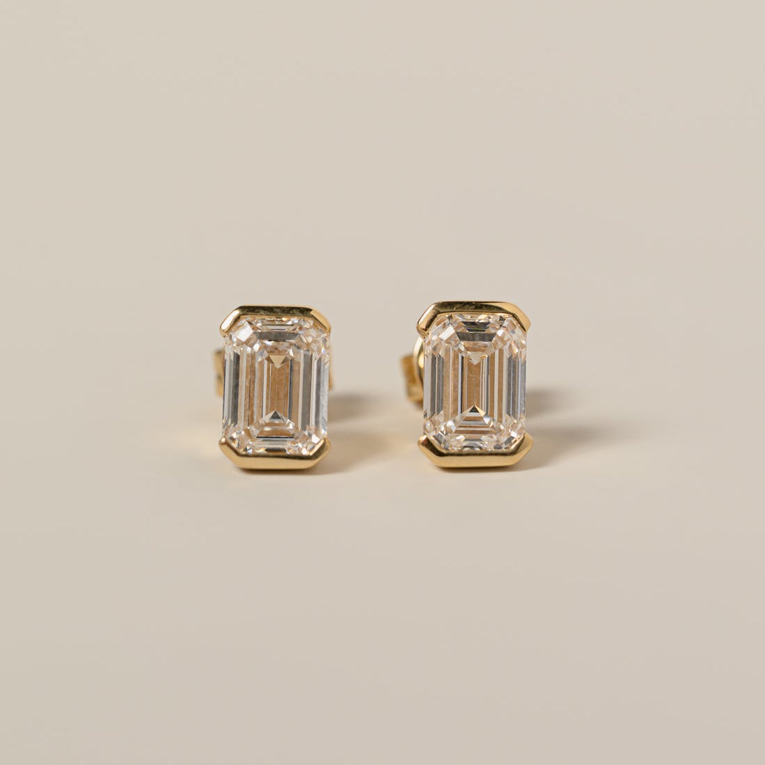 14k yellow gold half bezel set emerald cut lab diamond stud earrings