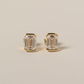 14k yellow gold half bezel set emerald cut lab diamond stud earrings