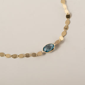 14k yellow gold oval east west bezel set blue topaz mirror chain bracelet