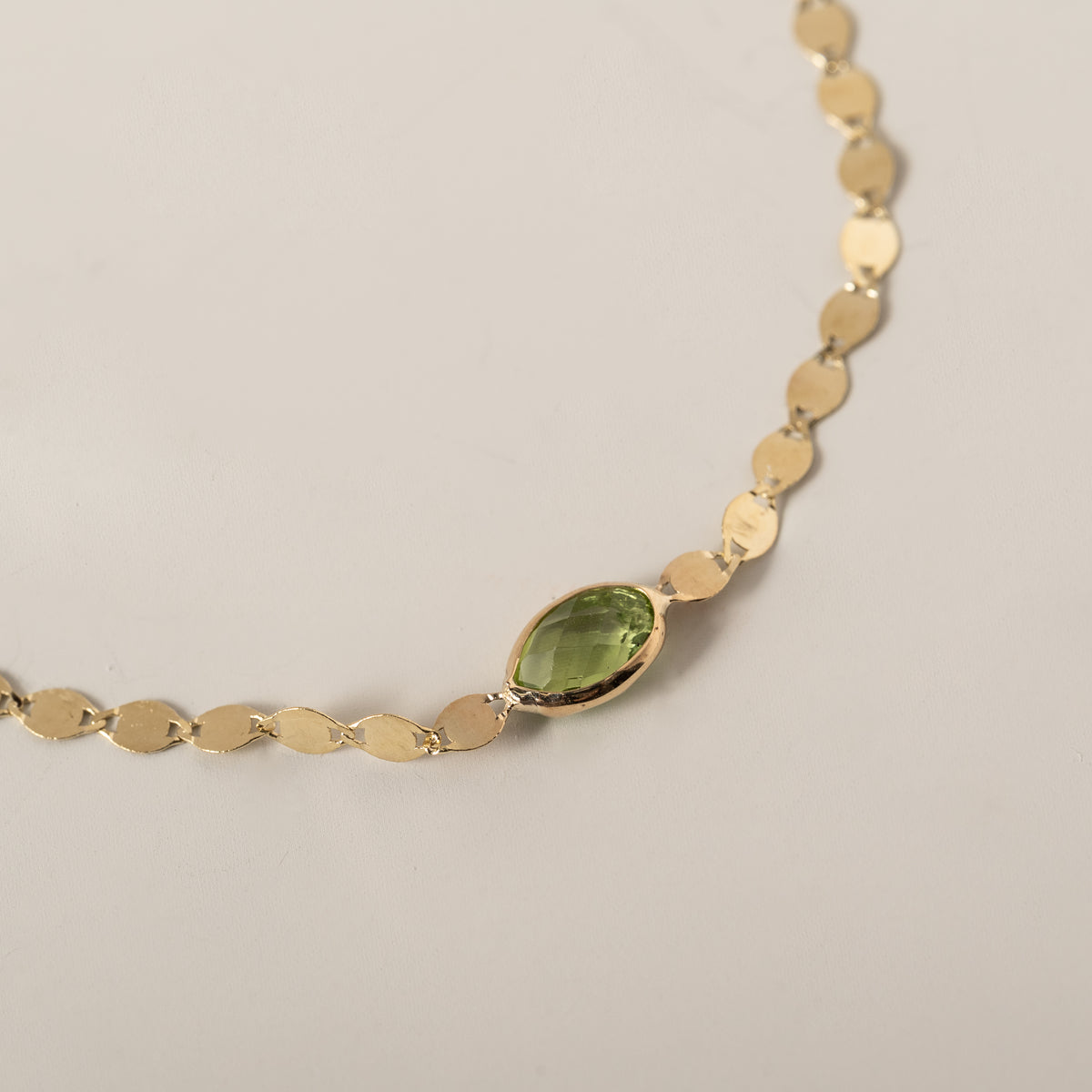 14k yellow gold oval east west bezel set peridot mirror chain bracelet