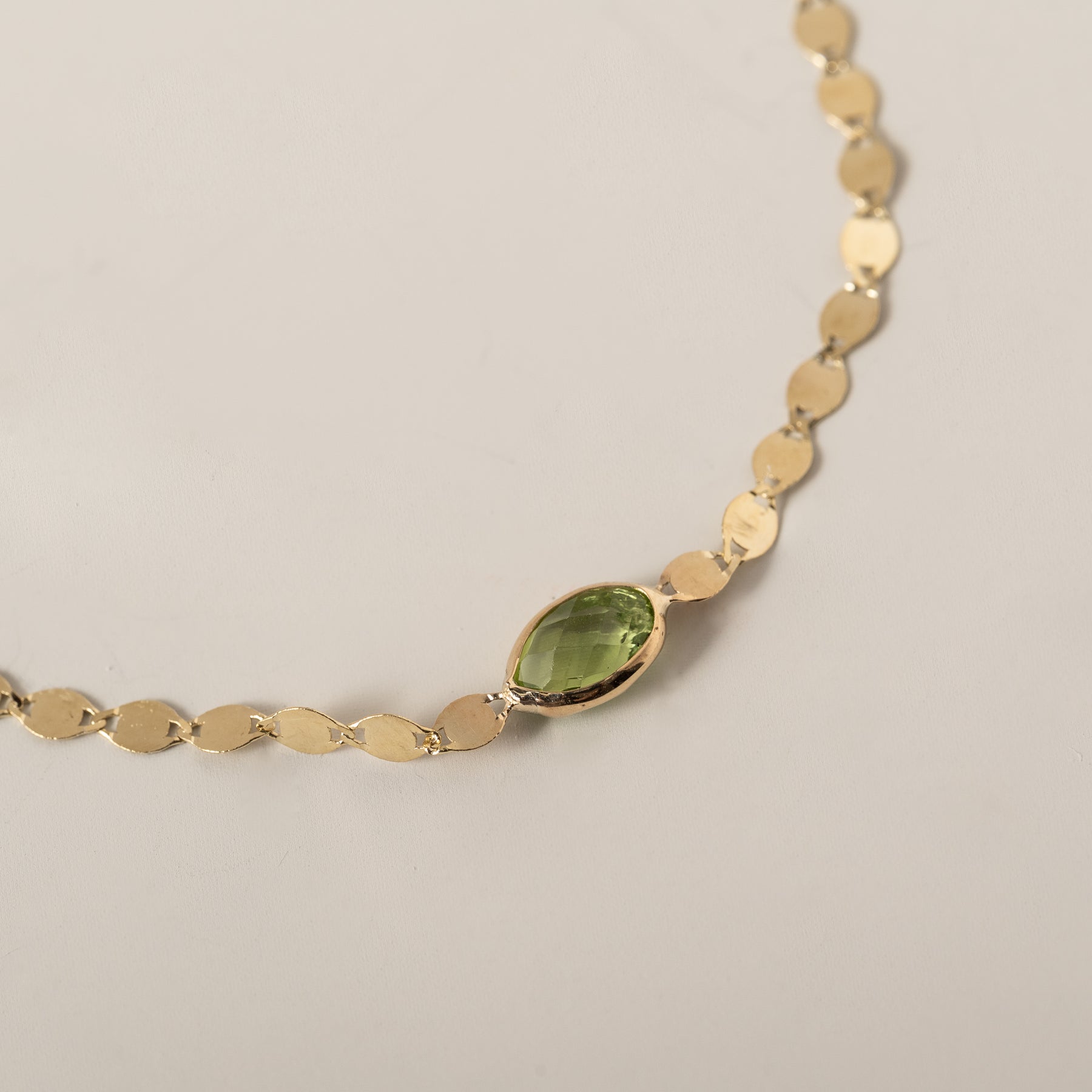 14k yellow gold oval east west bezel set peridot mirror chain bracelet