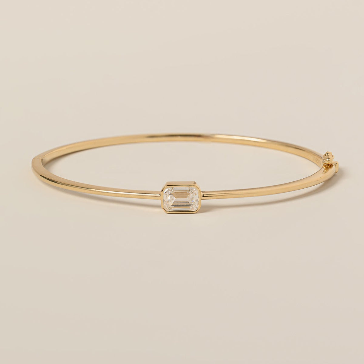 14k yellow gold bezel set east west emerald cut lab diamond bangle bracelet
