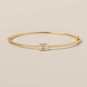 14k yellow gold bezel set east west emerald cut lab diamond bangle bracelet