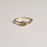 14ky round peridot prong set with diamond accent band ring