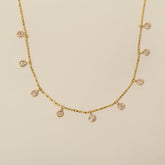 14k yellow gold bezel set diamond dangle station necklace on diamond bead cut chain