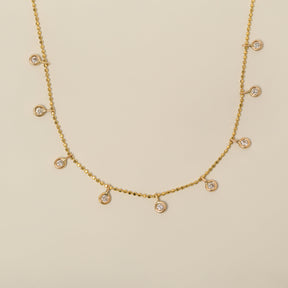 14k yellow gold bezel set diamond dangle station necklace on diamond bead cut chain