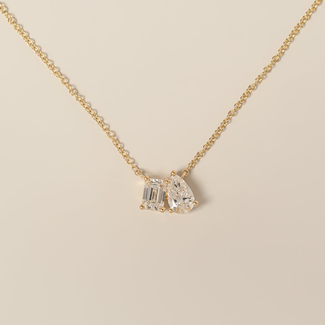 14k yellow gold emerald cut pear shape lab diamond toi et moi pendant necklace
