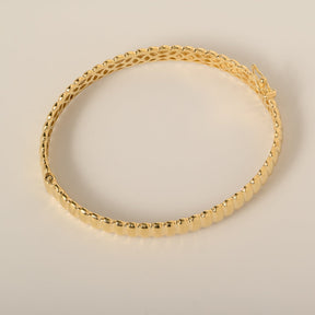 14k yellow gold polished grooved ridged bangle bracelet with safety clasp closure