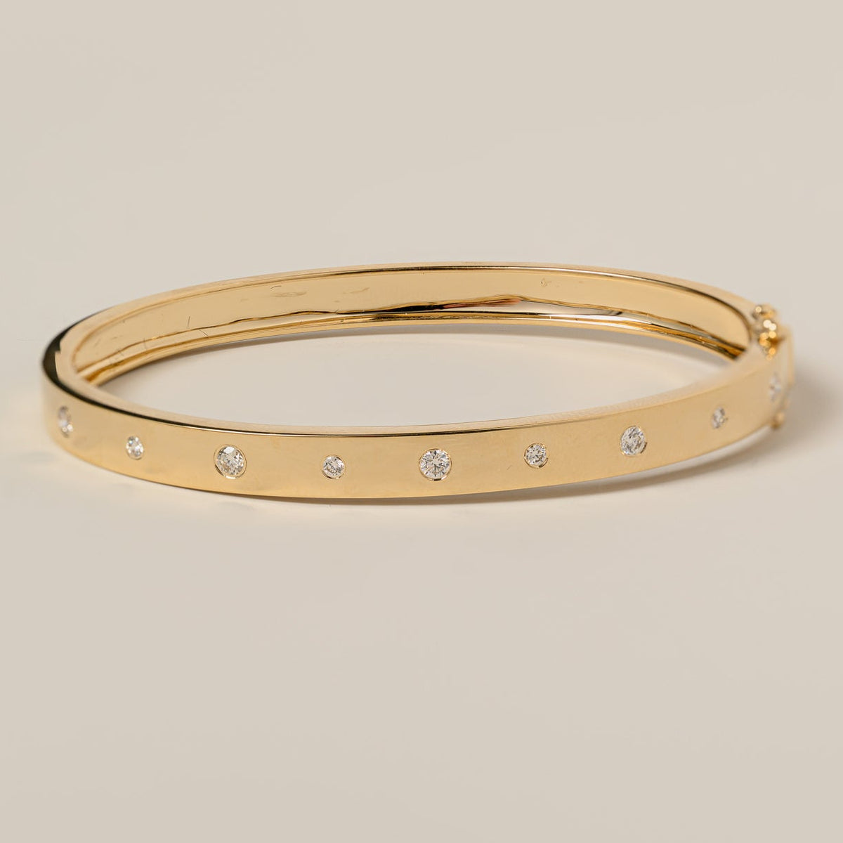 14k gold flush set round cut diamond bangle bracelet