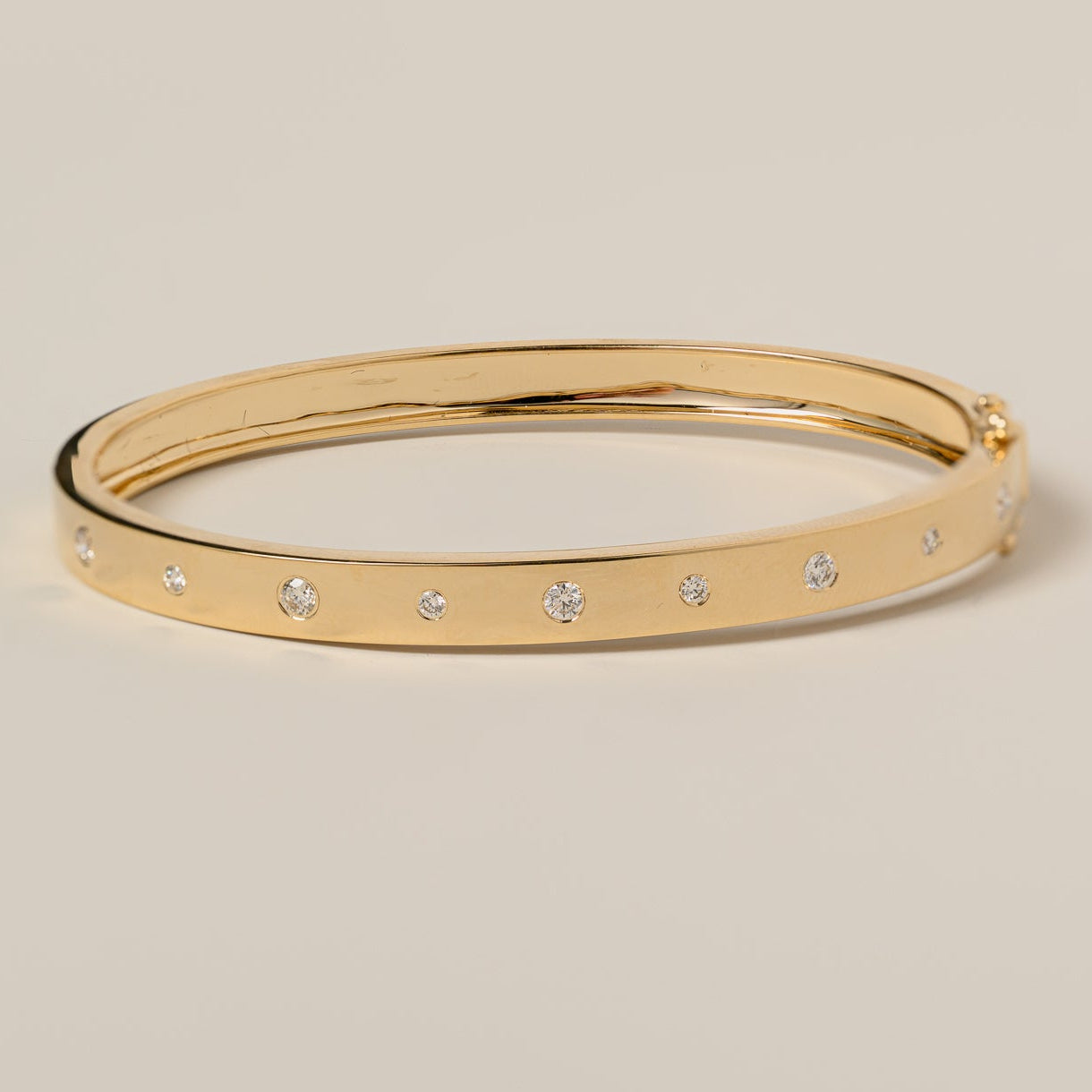 14k gold flush set round cut diamond bangle bracelet