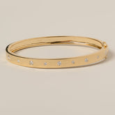 14k gold flush set round cut diamond bangle bracelet