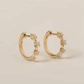 14k gold prong set spaced round cut diamond small hoop earrings