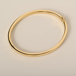 14k gold flat 4mm plain bangle with hinge and safety clasp closure