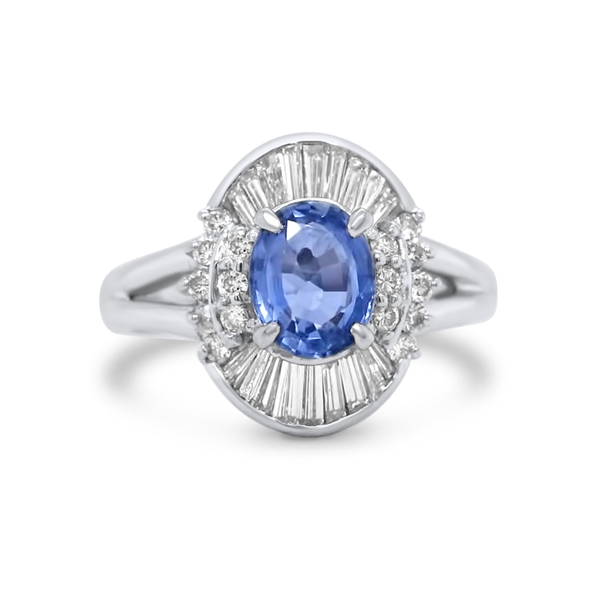 platinum unheated light blue oval sapphire with tapered baguette and round cut diamond halo estate engagement ring