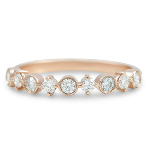 14k rose gold diamond wedding band with alternating prong and bezel set diamonds