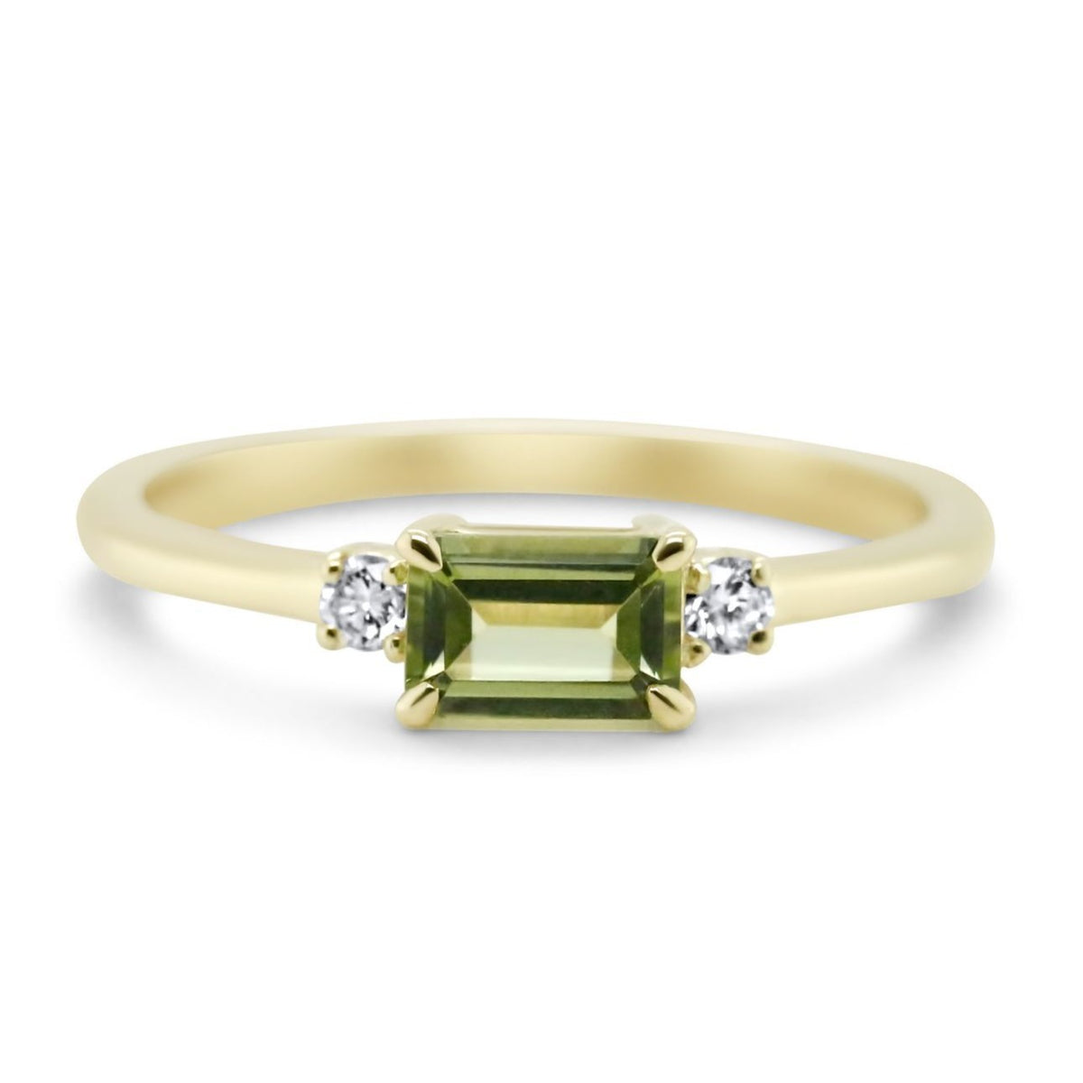 14k yellow gold three stone ring with 0.76ct emerald cut peridot and round cut diamonds
