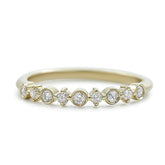 diamond wedding band with prong and bezel set diamonds available in white rose or yellow gold