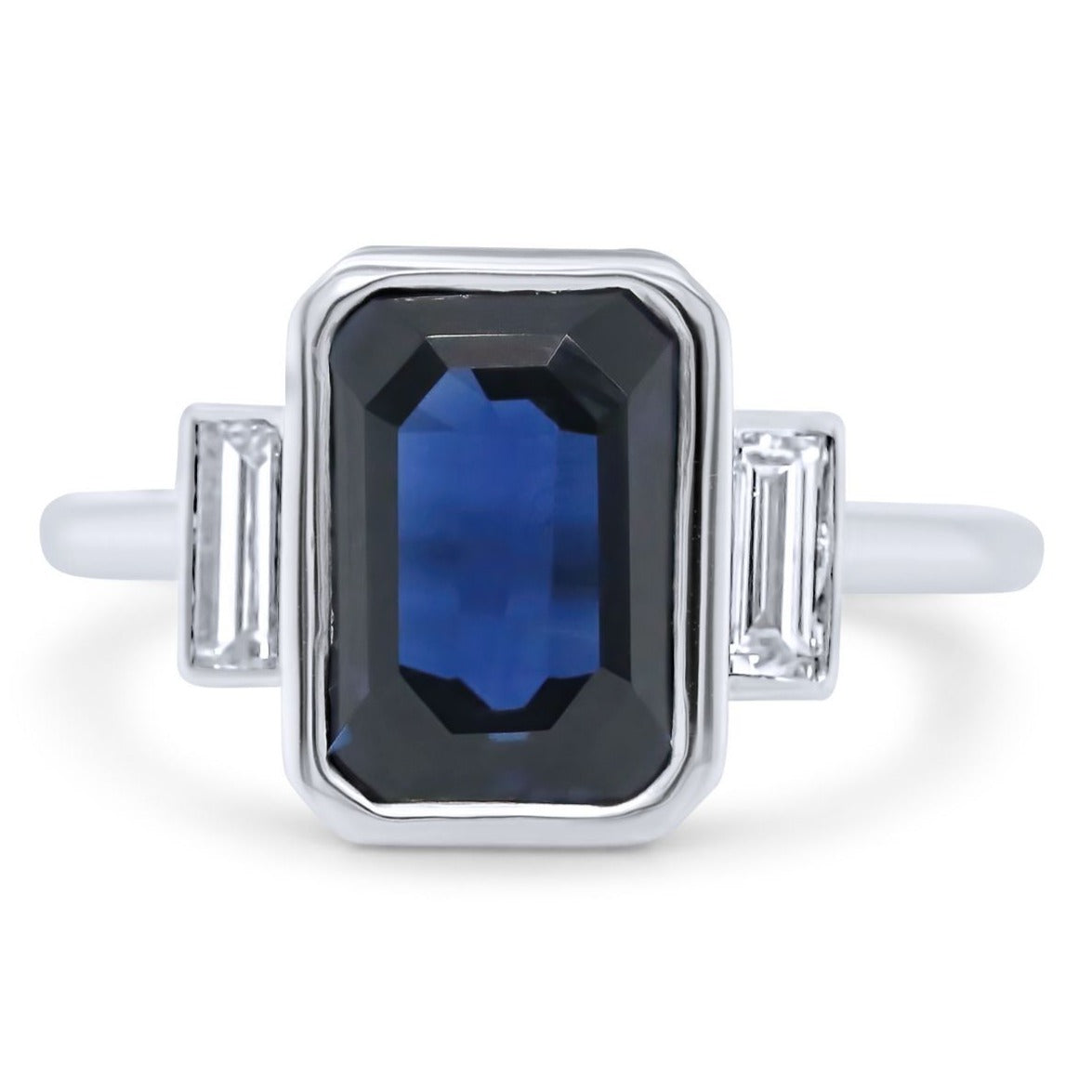 14k white gold blue emerald cut sapphire with diamond baguette side stones