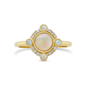 bezel set round opal NSEW bezel set accent opal and diamond halo 14k yellow gold ring