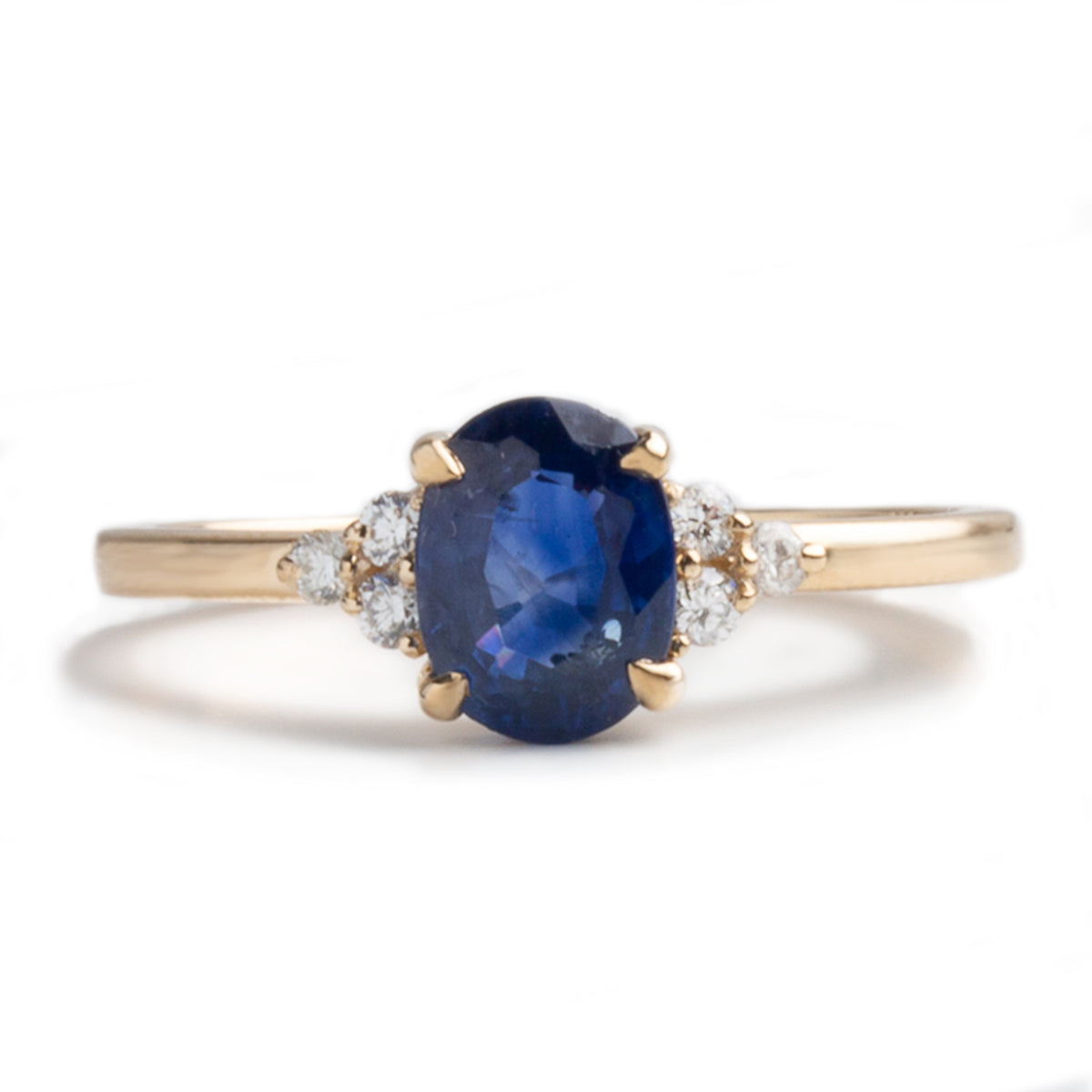 14k yellow gold 1.20ct oval cut blue sapphire diamond trio side stones engagement ring