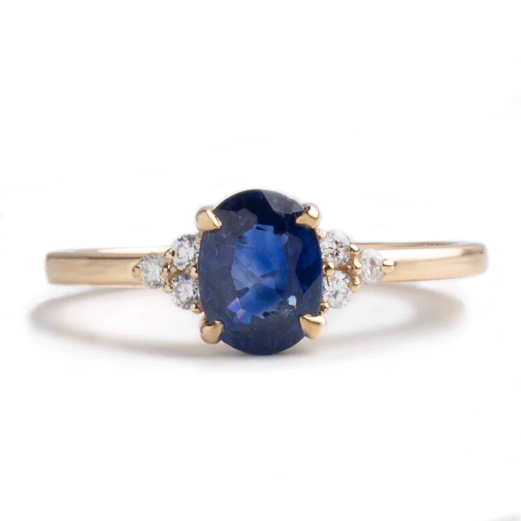 14k yellow gold 1.20ct oval cut blue sapphire diamond trio side stones engagement ring