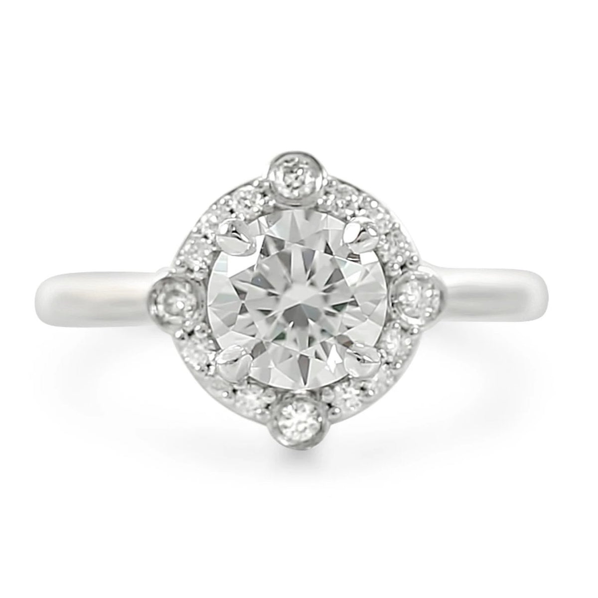 North, south, east, west diamond halo engagement ring ready to ship with a diamond center stone available in 14k yellow, white, rose or peach gold and platinum